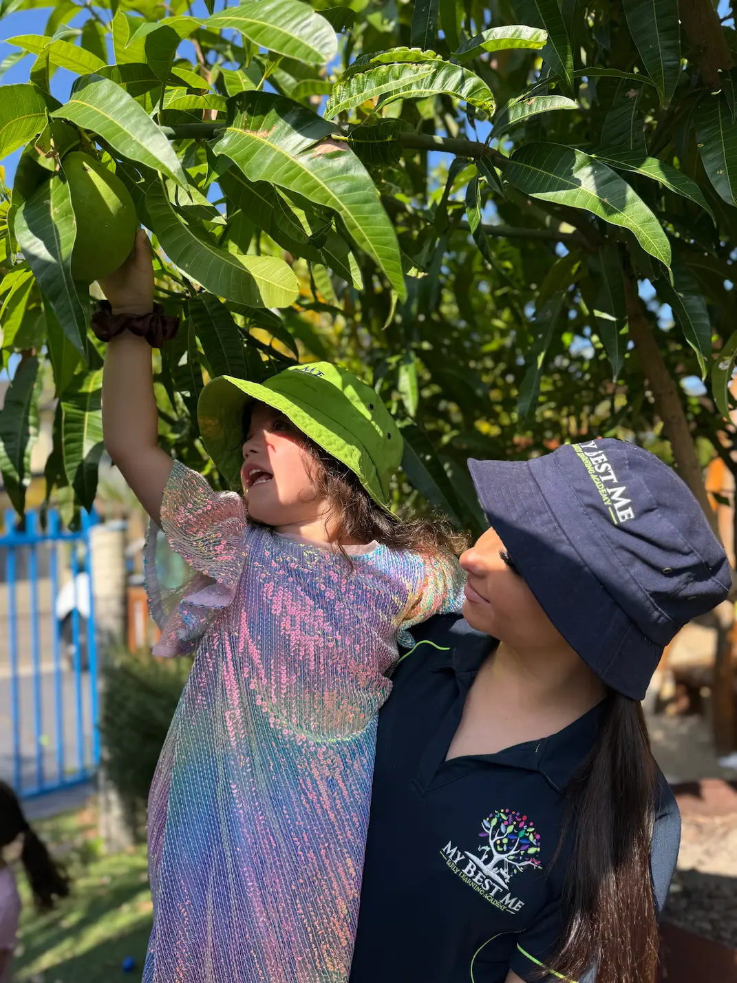 Children exploring outdoors at My Best Me Early Learning Academy